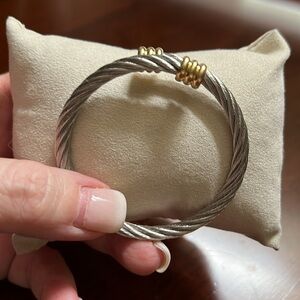 Silver with gold toned ends braided cable bracelet